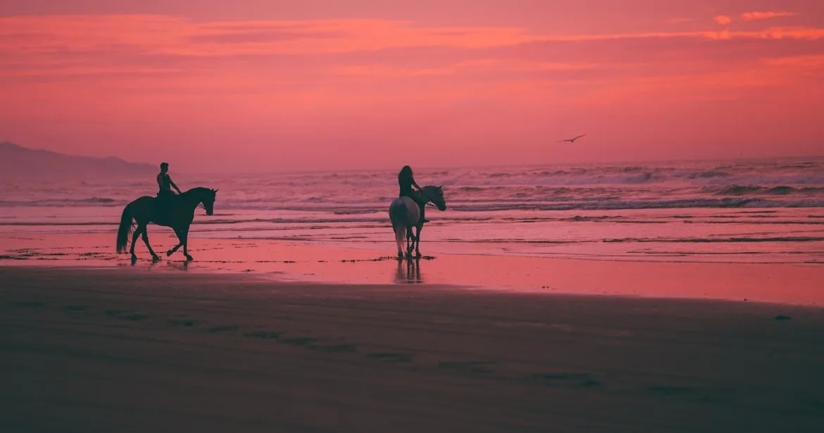 Horseback riding on a Guanacaste beach at sunset — regenerative travel experience in Costa Rica