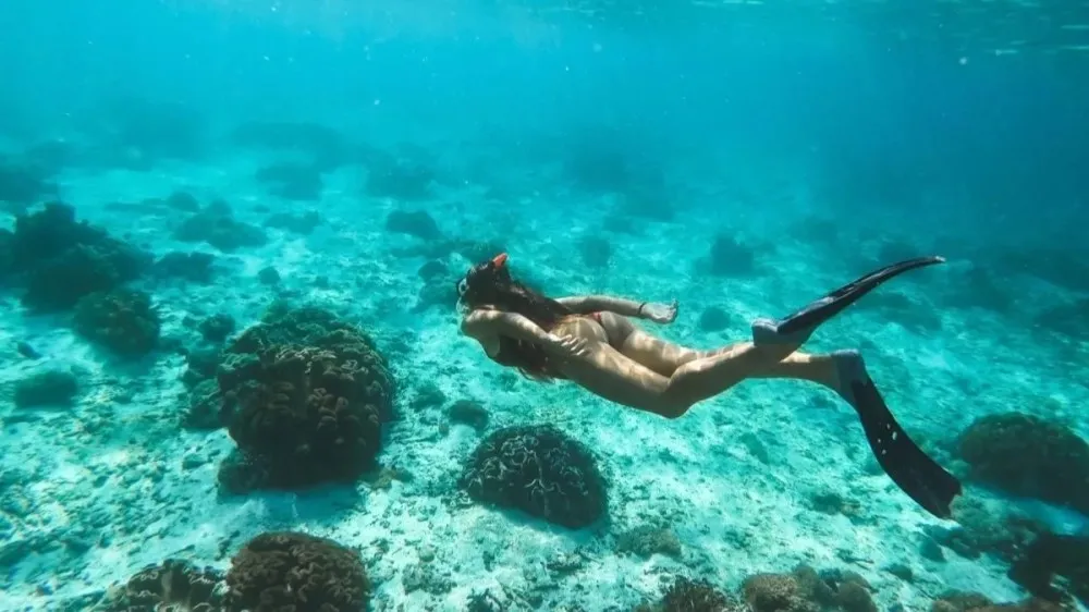 a man swimming in a pool of water