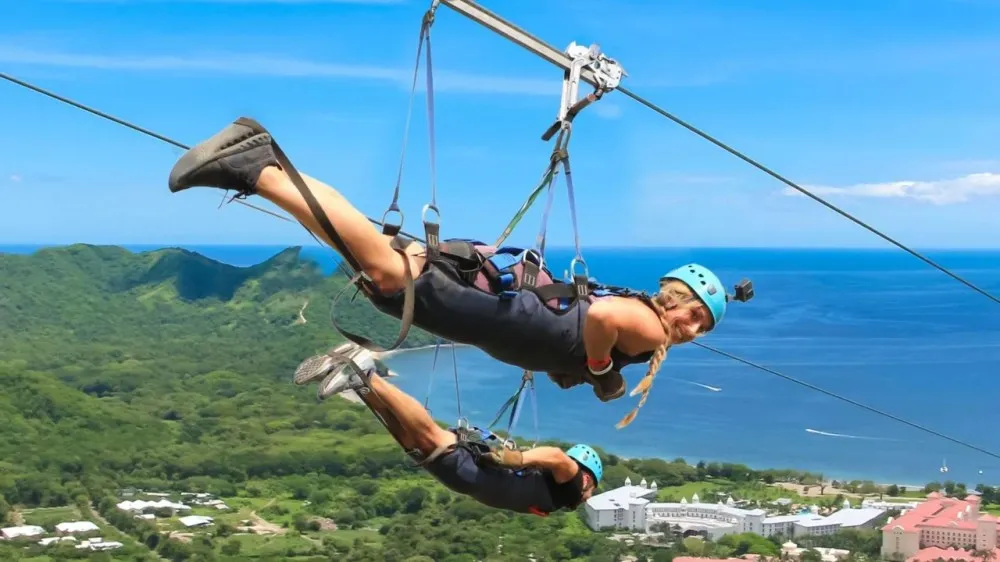 a person in a swing in a body of water