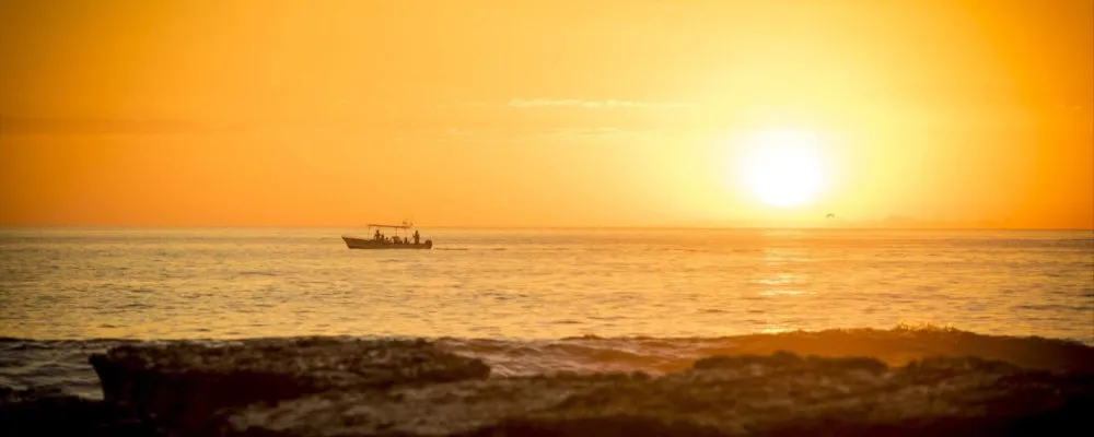 a sunset over a body of water
